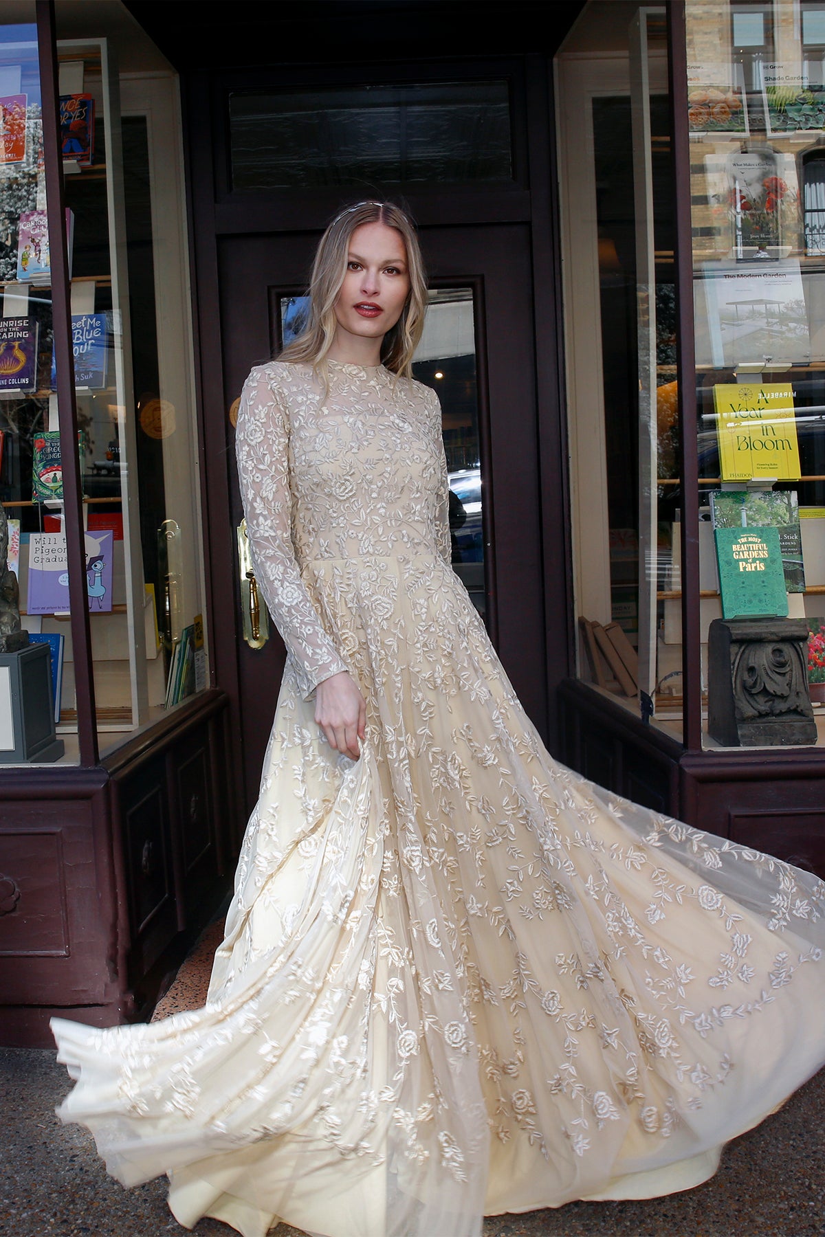 Olympia couture evening gown by Lavanya Coodly in a full-length front view, showcasing pale gold tulle, intricate silk-thread embroidery, and a dramatically flowing skirt.