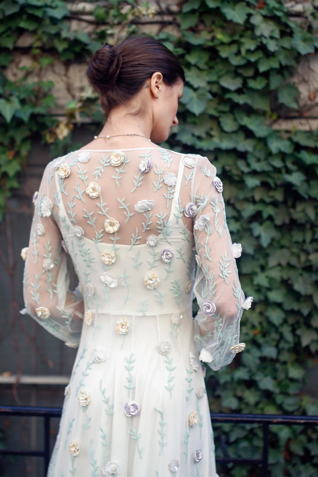 Back detail of Rosalind gown by Lavanya Coodly with sheer embroidered sleeves and dimensional floral appliqués