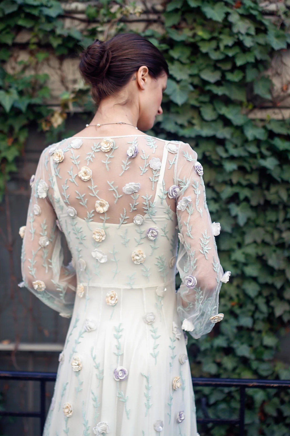 Back detail of Rosalind gown by Lavanya Coodly with sheer embroidered sleeves and dimensional floral appliqués