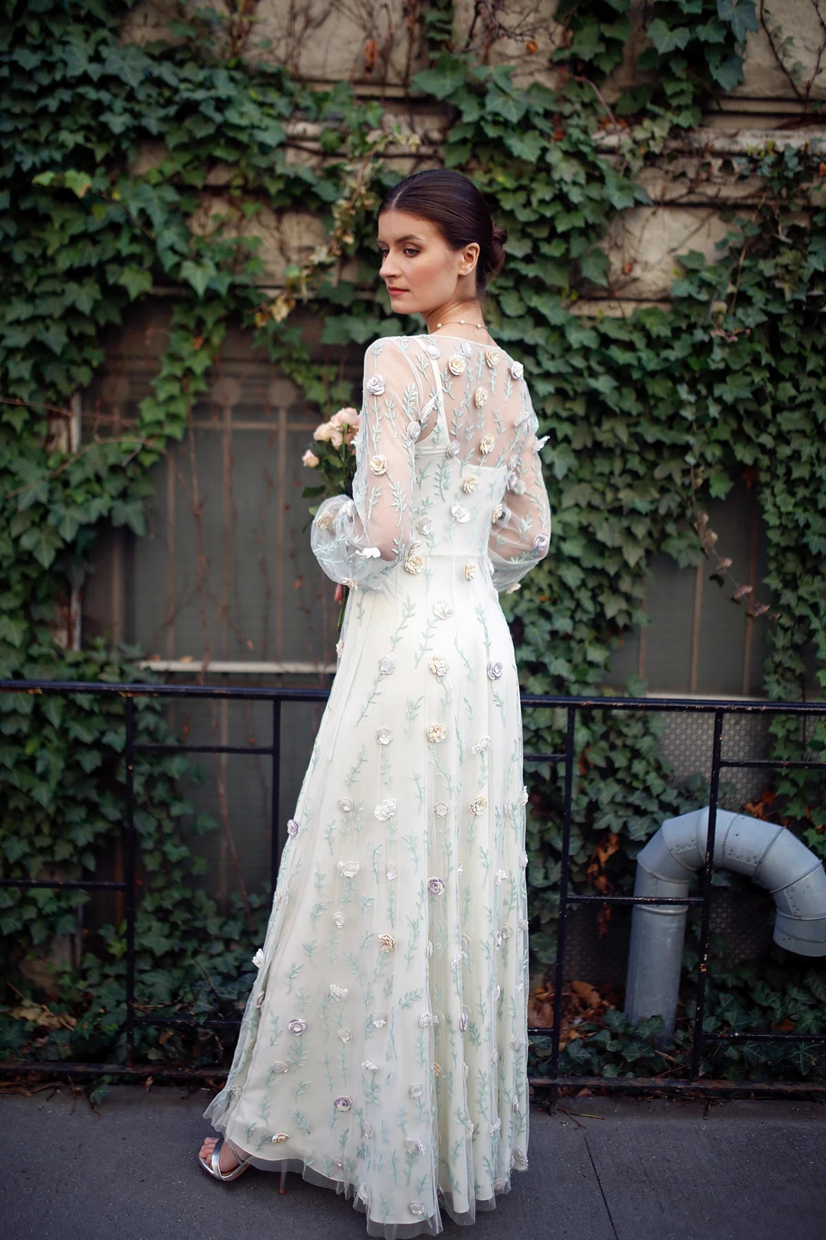 Back view of Rosalind gown by Lavanya Coodly with sheer embroidered sleeves and 3D floral appliqués