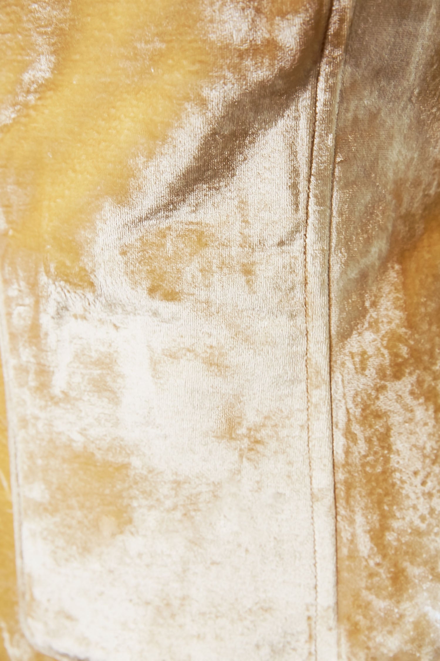 Close-up of pale gold silk velvet fabric on the Lavanya Coodly Jillian gown
