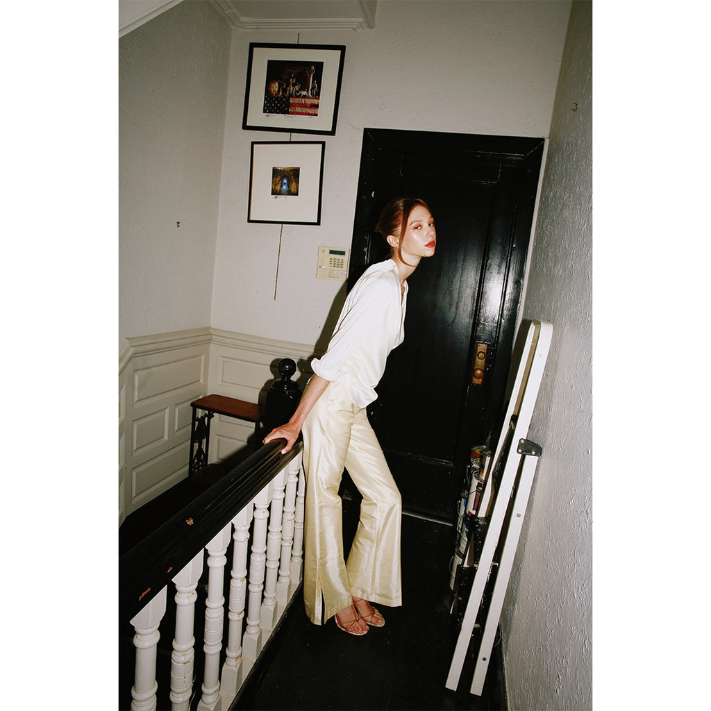 Lavanya Coodly Delphine silk blouse in cream, side view styled with Lucienne trousers